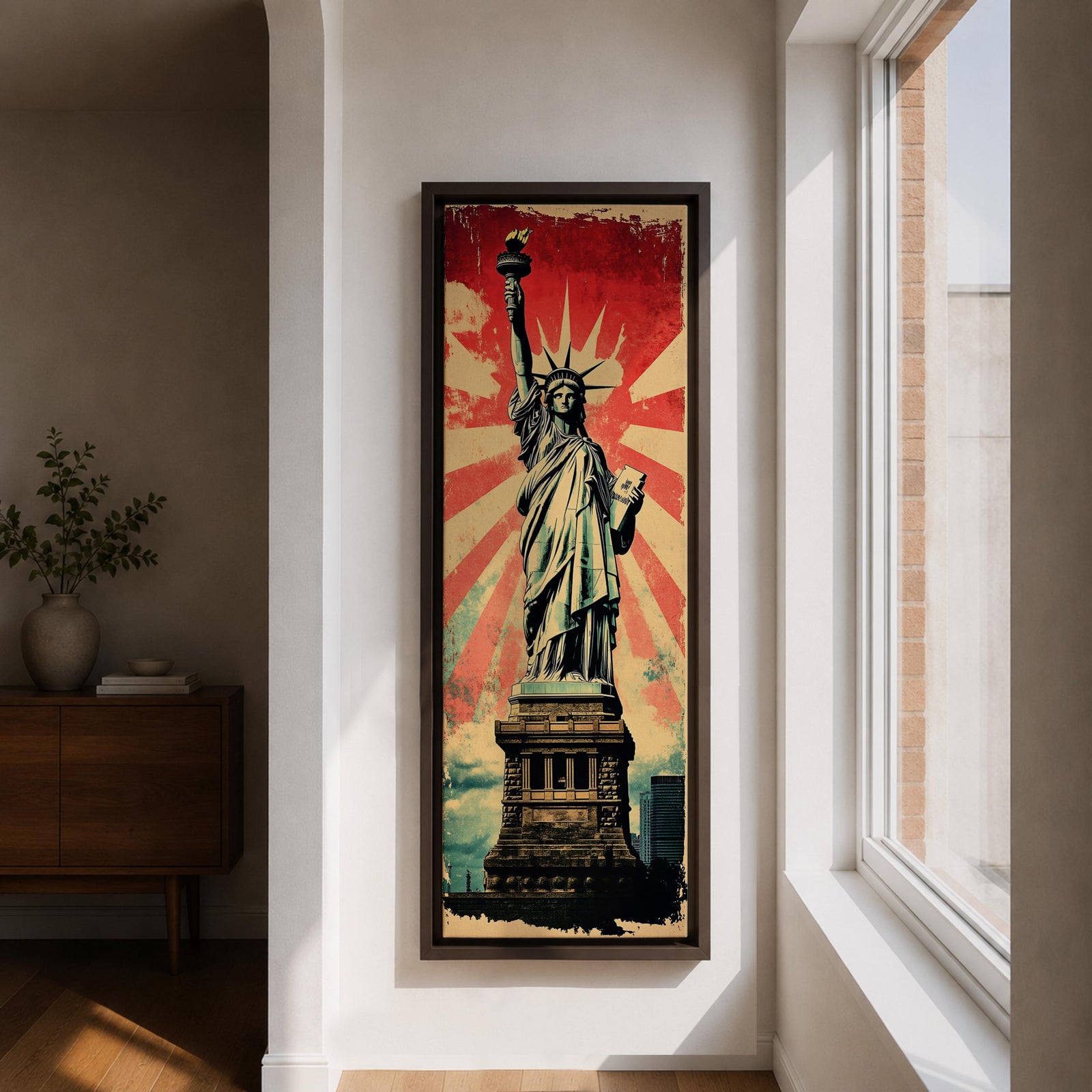 Long vertical retro poster style artwork featuring the Statue of Liberty standing on her pedestal holding the torch high with a tablet in her arm. Bold red sunburst rays radiate behind the monument while distressed textures and muted green tones create a vintage propaganda inspired illustration of the iconic New York landmark.