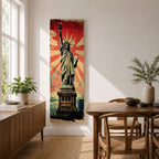Long vertical retro poster style artwork featuring the Statue of Liberty standing on her pedestal holding the torch high with a tablet in her arm. Bold red sunburst rays radiate behind the monument while distressed textures and muted green tones create a vintage propaganda inspired illustration of the iconic New York landmark.