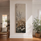 Long vertical painting of delicate wildflowers and daisies rising through tall meadow grasses in soft neutral tones. White petals with warm golden centers appear among slender stems and subtle foliage against a muted beige sky creating a calm botanical meadow composition with layered natural textures.
