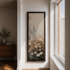 Long vertical painting of delicate wildflowers and daisies rising through tall meadow grasses in soft neutral tones. White petals with warm golden centers appear among slender stems and subtle foliage against a muted beige sky creating a calm botanical meadow composition with layered natural textures.