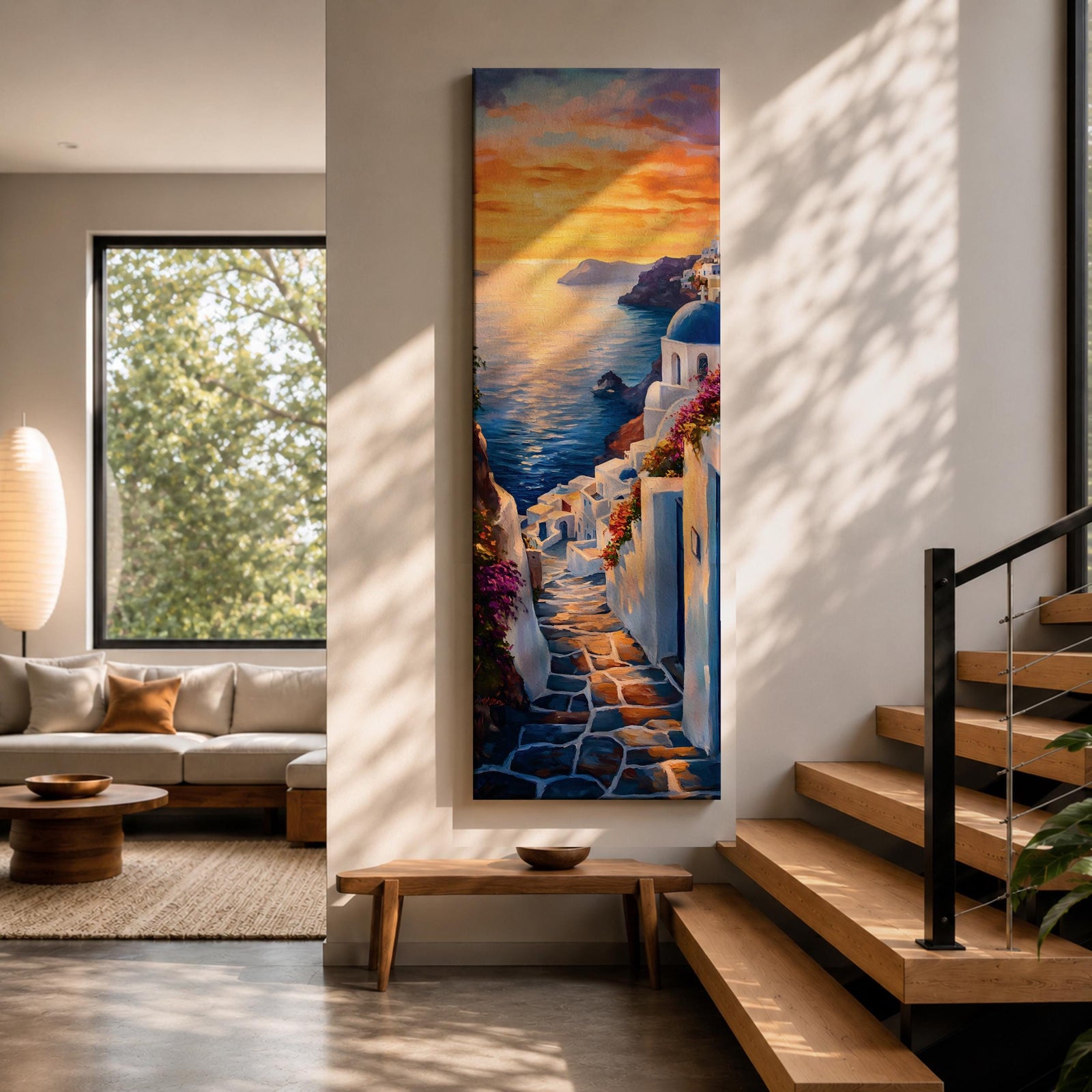 Long vertical painting of a Santorini coastal village with whitewashed buildings and a blue dome church overlooking the sea at sunset. A stone pathway descends between bright white walls toward the shoreline while golden sunlight reflects across calm water and warm clouds fill the sky.