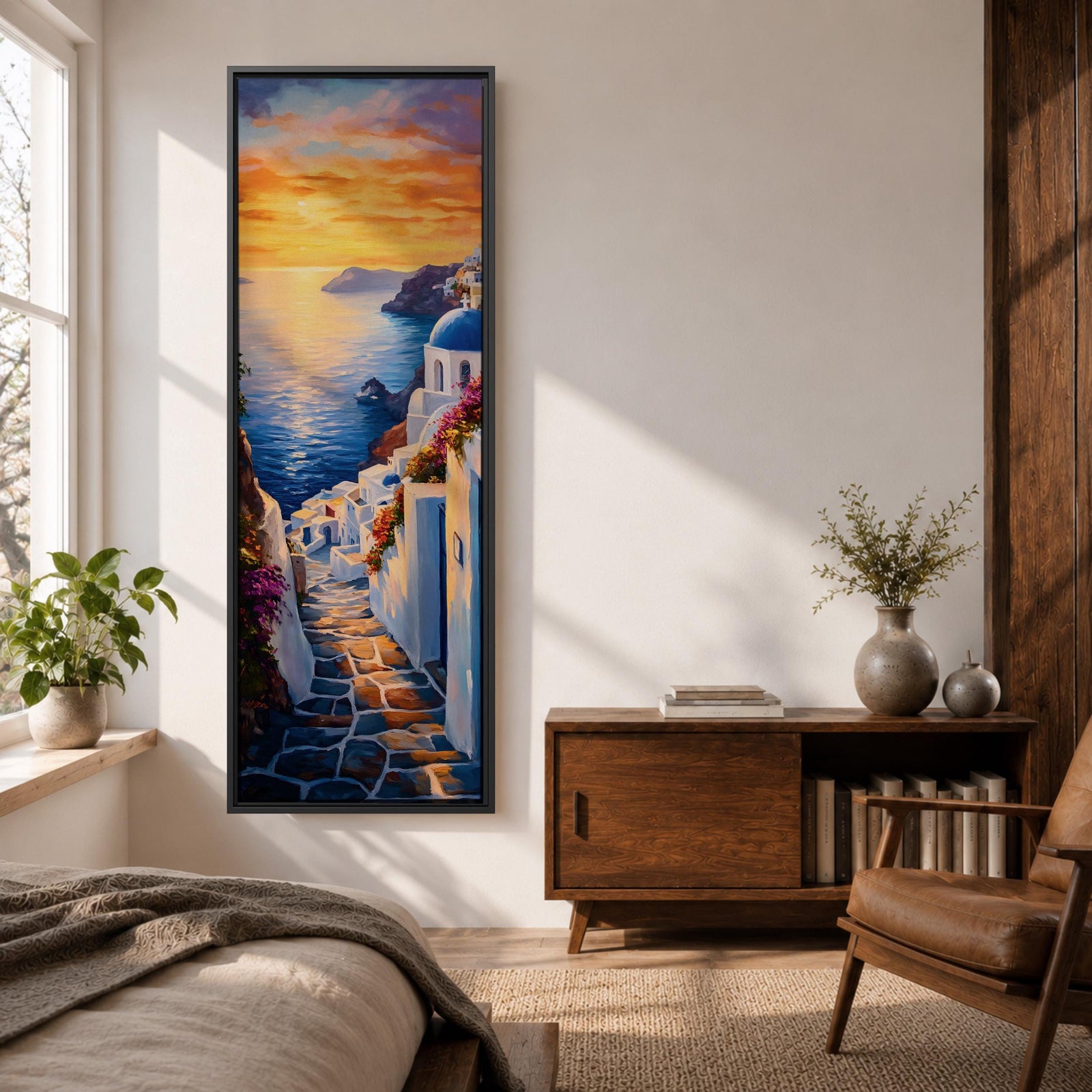 Long vertical painting of a Santorini coastal village with whitewashed buildings and a blue dome church overlooking the sea at sunset. A stone pathway descends between bright white walls toward the shoreline while golden sunlight reflects across calm water and warm clouds fill the sky.