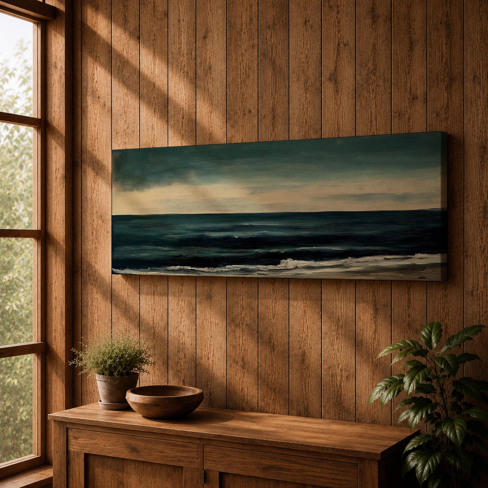 Panoramic seascape painting showing dark rolling waves beneath a dramatic cloudy sky with faint light breaking along the distant horizon. Deep teal and navy tones blend across the water while textured brushstrokes form soft foam along the shoreline, creating a moody minimalist coastal composition across the wide horizontal canvas.