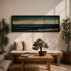 Panoramic seascape painting showing dark rolling waves beneath a dramatic cloudy sky with faint light breaking along the distant horizon. Deep teal and navy tones blend across the water while textured brushstrokes form soft foam along the shoreline, creating a moody minimalist coastal composition across the wide horizontal canvas.