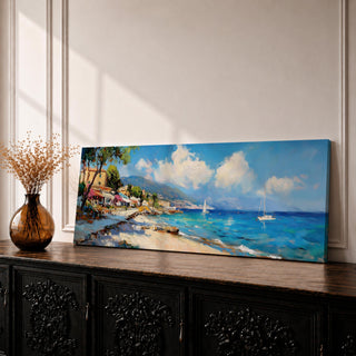 Panoramic Mediterranean coastal village painting featuring bright turquoise sea with sailboats near a rocky shoreline lined with colorful houses and flowering trees. Rolling hills rise in the distance beneath a blue sky with soft clouds, while textured brushstrokes capture waves and sunlight across the wide seascape.