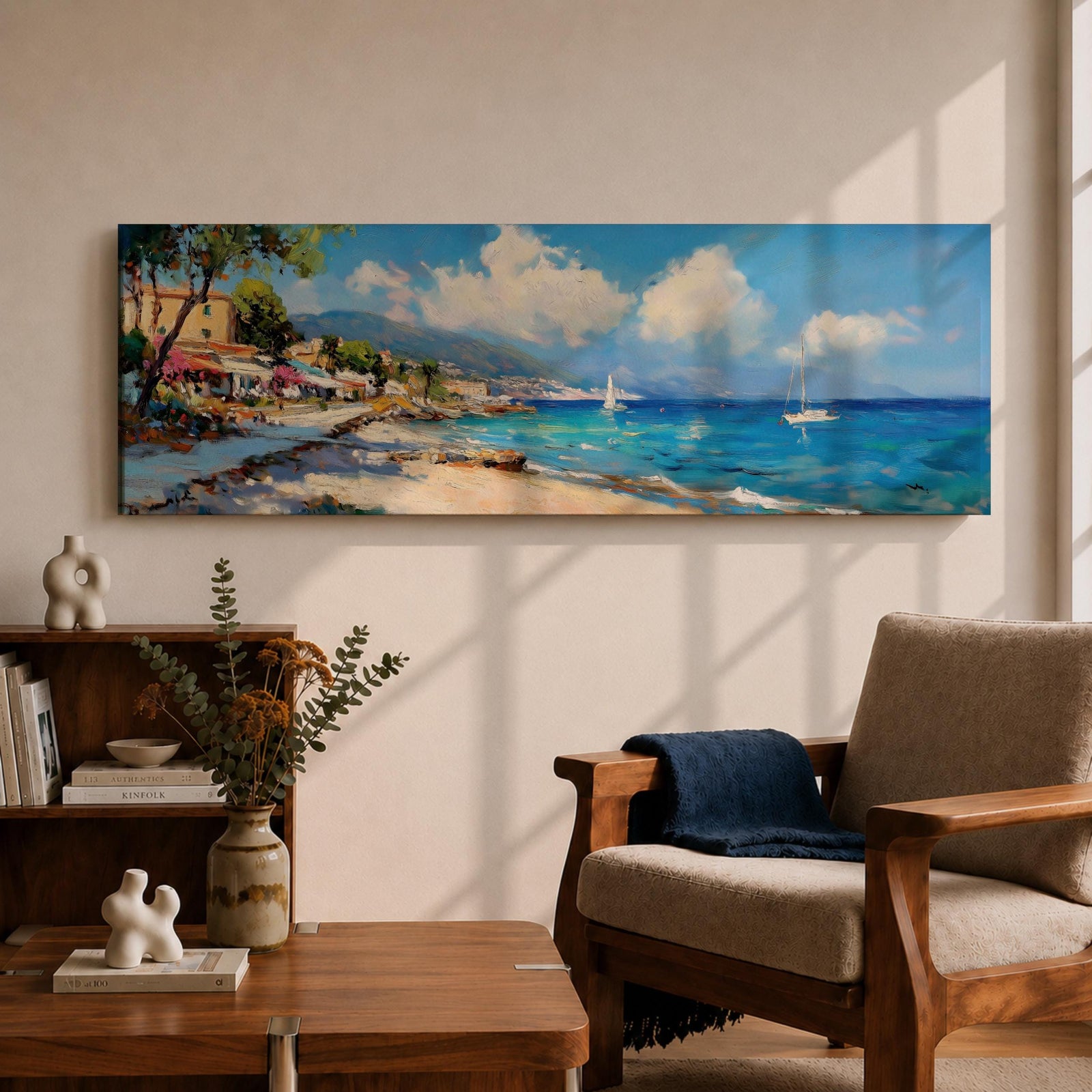 Panoramic Mediterranean coastal village painting featuring bright turquoise sea with sailboats near a rocky shoreline lined with colorful houses and flowering trees. Rolling hills rise in the distance beneath a blue sky with soft clouds, while textured brushstrokes capture waves and sunlight across the wide seascape.