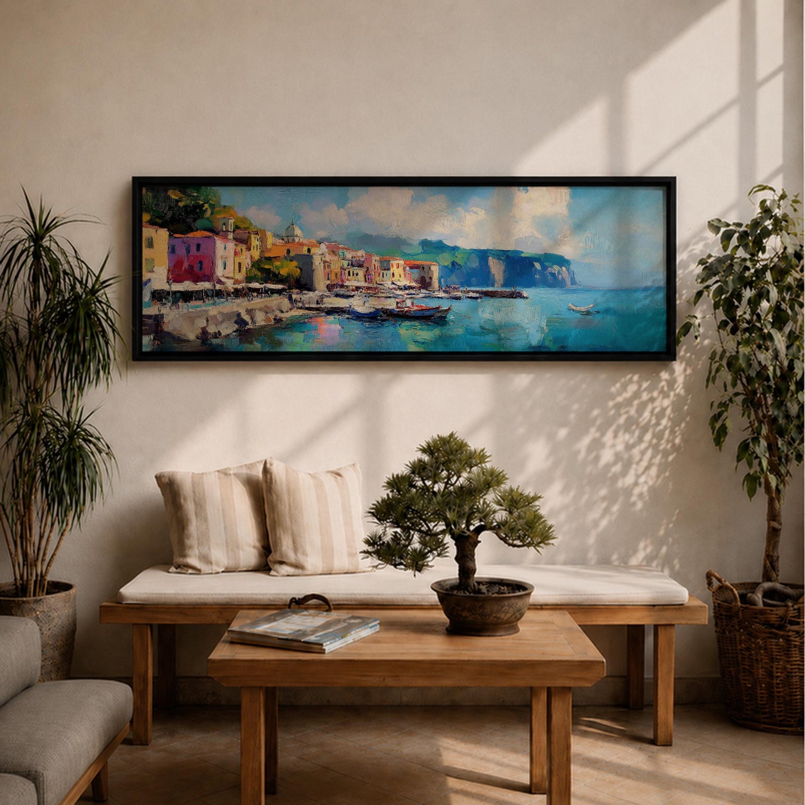 Panoramic Mediterranean harbor village painting featuring colorful seaside houses along a stone waterfront with small fishing boats resting in calm blue water. Soft clouds drift above distant cliffs and green hills while textured brushstrokes capture reflections and gentle movement across the wide coastal scene.