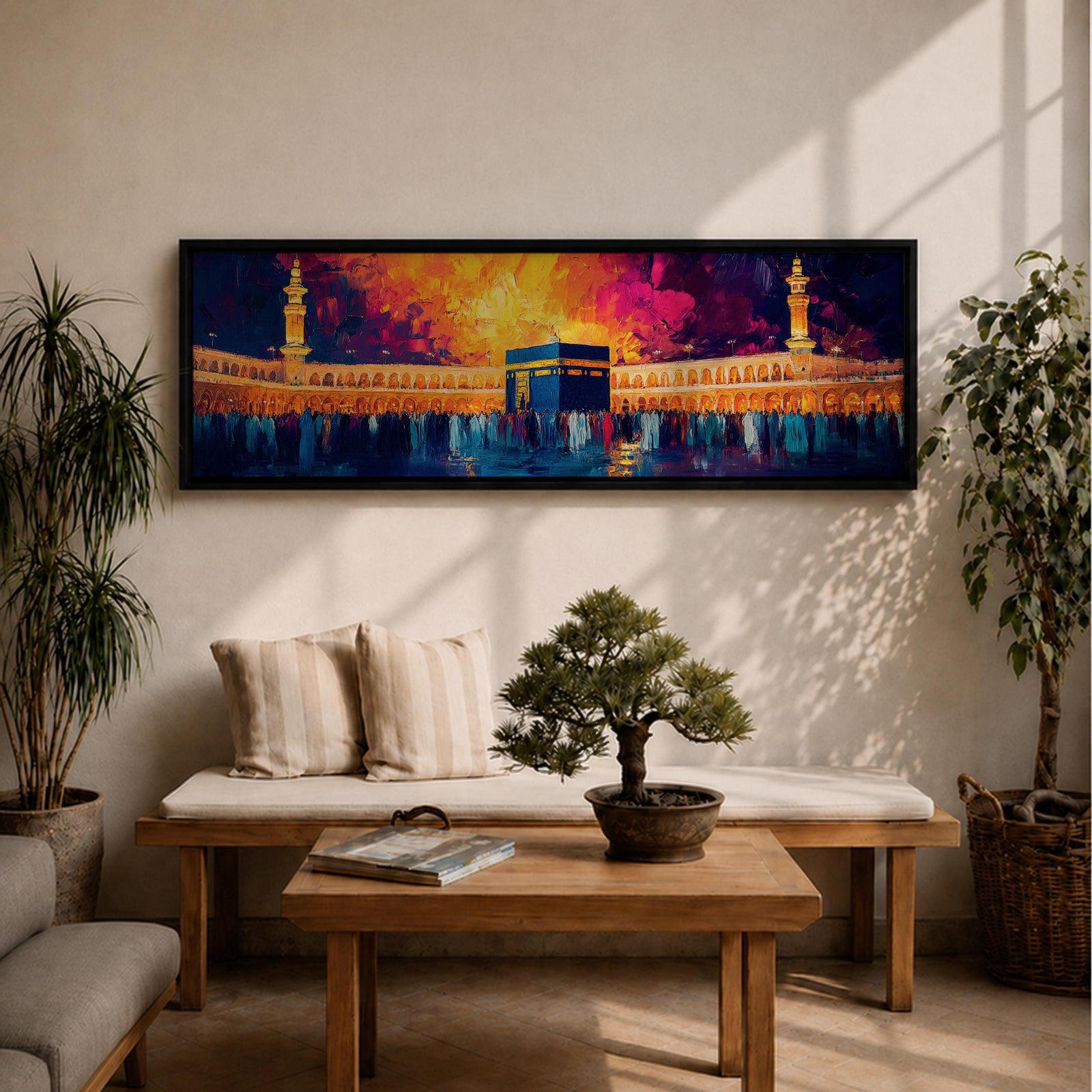 Panoramic painting of the Kaaba at Masjid Al Haram in Mecca surrounded by worshippers within the illuminated mosque courtyard. Tall minarets rise on either side while glowing sunset colors of gold, magenta, and deep blue fill the sky above the sacred Islamic landmark across the wide horizontal composition.