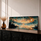 Panoramic Chinese landscape painting of misty mountains rising above a tranquil lake at sunset with warm orange light reflecting across the water. Dark tree silhouettes frame the shoreline while distant peaks fade into atmospheric haze beneath dramatic clouds in a traditional oriental scenery composition.
