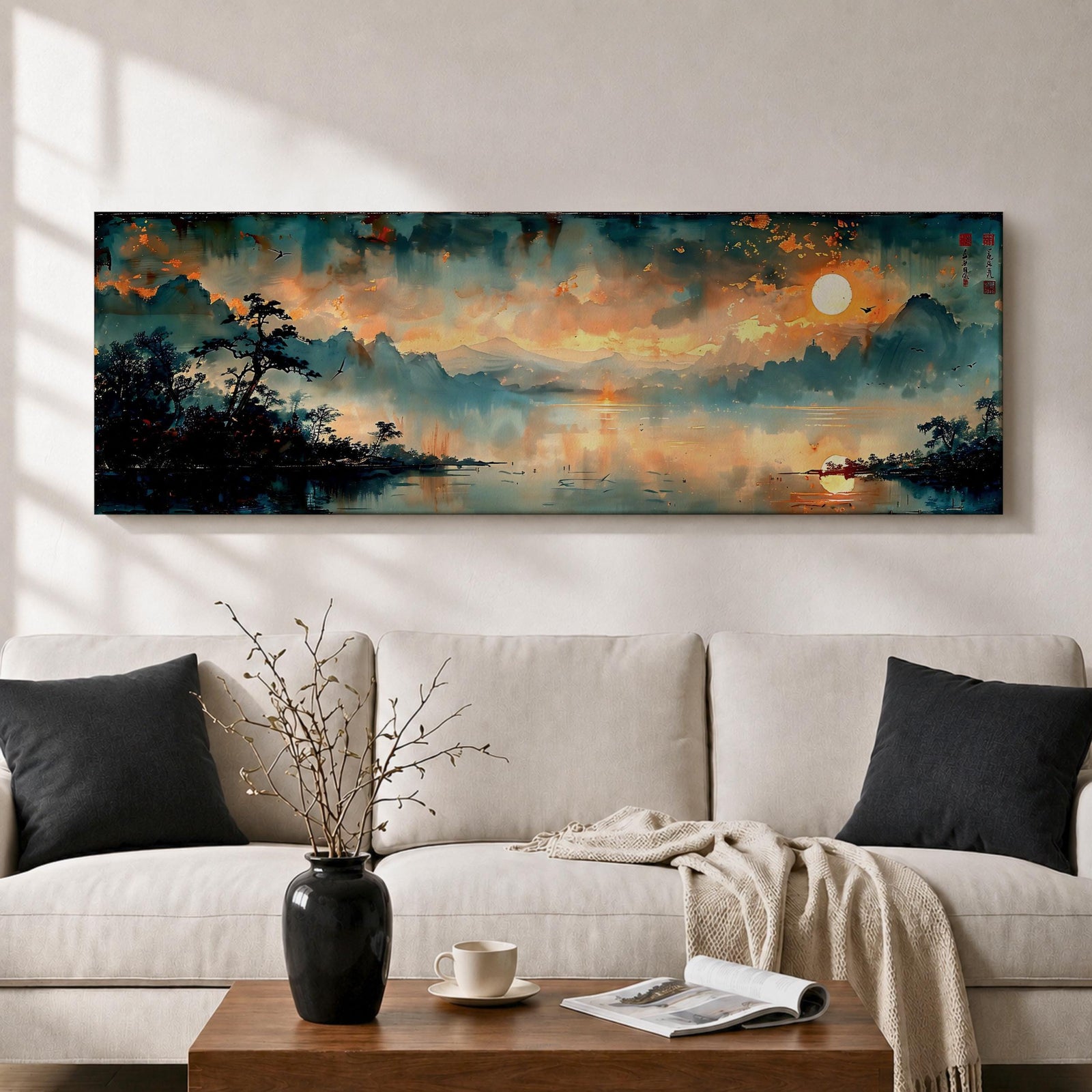 Panoramic Chinese landscape painting of misty mountains rising above a tranquil lake at sunset with warm orange light reflecting across the water. Dark tree silhouettes frame the shoreline while distant peaks fade into atmospheric haze beneath dramatic clouds in a traditional oriental scenery composition.