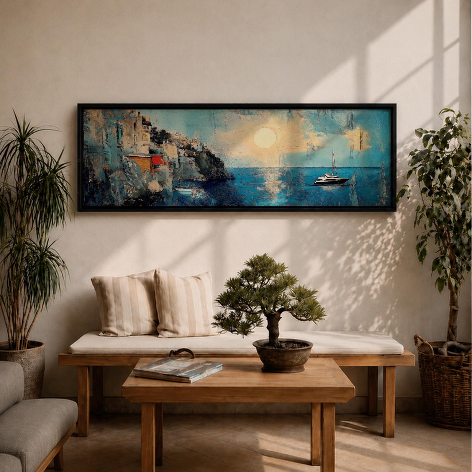 Panoramic Mediterranean coastal painting showing white cliffside houses overlooking deep blue sea at sunset. A sailboat drifts across calm water while sunlight reflects across the horizon and textured brushstrokes form dramatic rocky cliffs and coastal architecture in the wide horizontal seaside composition.