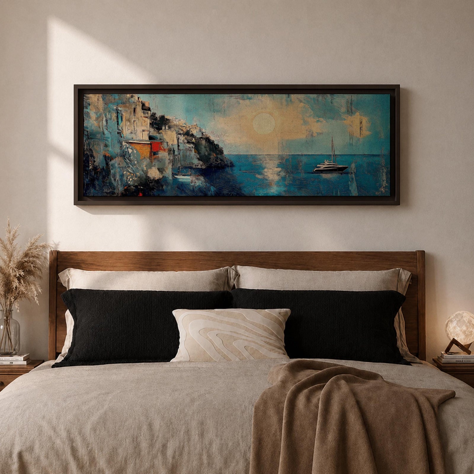 Panoramic Mediterranean coastal painting showing white cliffside houses overlooking deep blue sea at sunset. A sailboat drifts across calm water while sunlight reflects across the horizon and textured brushstrokes form dramatic rocky cliffs and coastal architecture in the wide horizontal seaside composition.