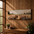 Panoramic wildflower meadow landscape painting featuring a soft rural field filled with scattered blue and white flowers across golden grasses. A narrow path leads through the meadow toward distant trees and open countryside beneath a muted cloudy sky, with textured brushstrokes creating depth across the wide pastoral scene.