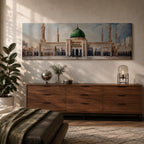 Panoramic architectural painting of Masjid Nabawi in Medina featuring the iconic green dome centered among elegant minarets and grand mosque arches. The courtyard stretches across the composition while soft clouds gather above the sacred structure, highlighting detailed Islamic architecture across the wide skyline.