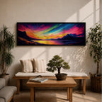 Panoramic northern lights landscape painting showing vibrant aurora borealis ribbons sweeping across a night sky in bright greens pinks and purples. Dark mountain silhouettes frame a reflective lake while glowing colors spread across the horizon creating a dramatic wide arctic night scene.