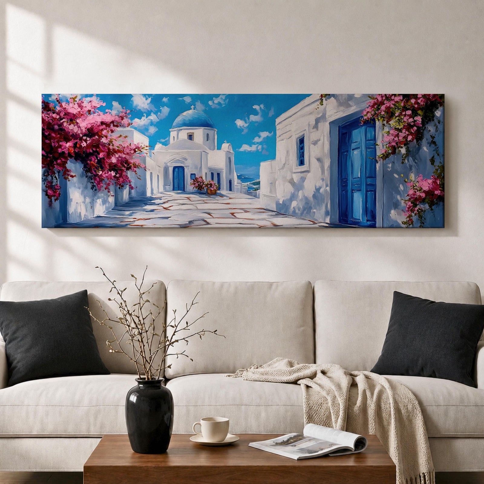 Panoramic painting of a Santorini village featuring whitewashed buildings with blue doors and a domed church along a sunlit stone pathway. Pink bougainvillea flowers frame the scene while bright blue sky and distant Aegean Sea appear beyond the island architecture across the wide composition.