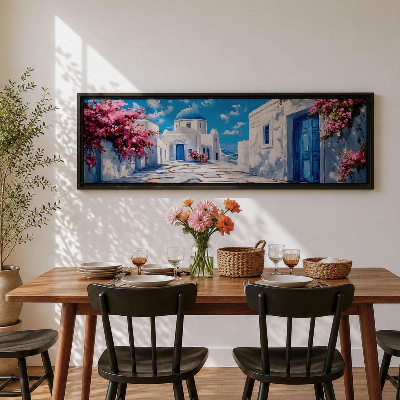 Panoramic painting of a Santorini village featuring whitewashed buildings with blue doors and a domed church along a sunlit stone pathway. Pink bougainvillea flowers frame the scene while bright blue sky and distant Aegean Sea appear beyond the island architecture across the wide composition.