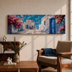 Panoramic painting of a Santorini village featuring whitewashed buildings with blue doors and a domed church along a sunlit stone pathway. Pink bougainvillea flowers frame the scene while bright blue sky and distant Aegean Sea appear beyond the island architecture across the wide composition.