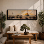 Panoramic painting of the Dome of the Rock in Jerusalem with its iconic golden dome rising above surrounding mosque structures, arches, and a tall minaret. The composition stretches horizontally with textured brushwork in warm sand, gold, and earthy tones, depicting the mosque complex and trees in a loose impressionistic architectural landscape style.