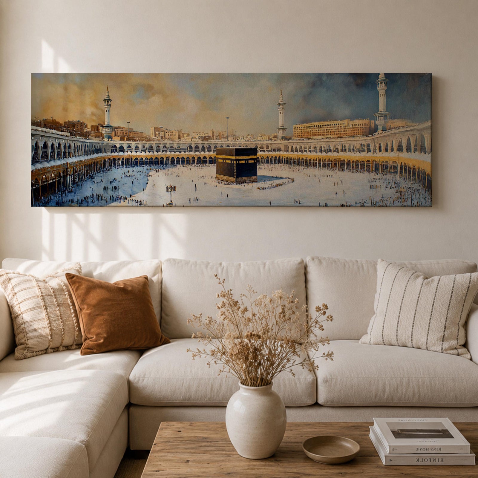 Panoramic Islamic wall art showing the Kaaba at Masjid Al Haram in Mecca surrounded by mosque arches, minarets, and pilgrims in a wide sacred courtyard scene.