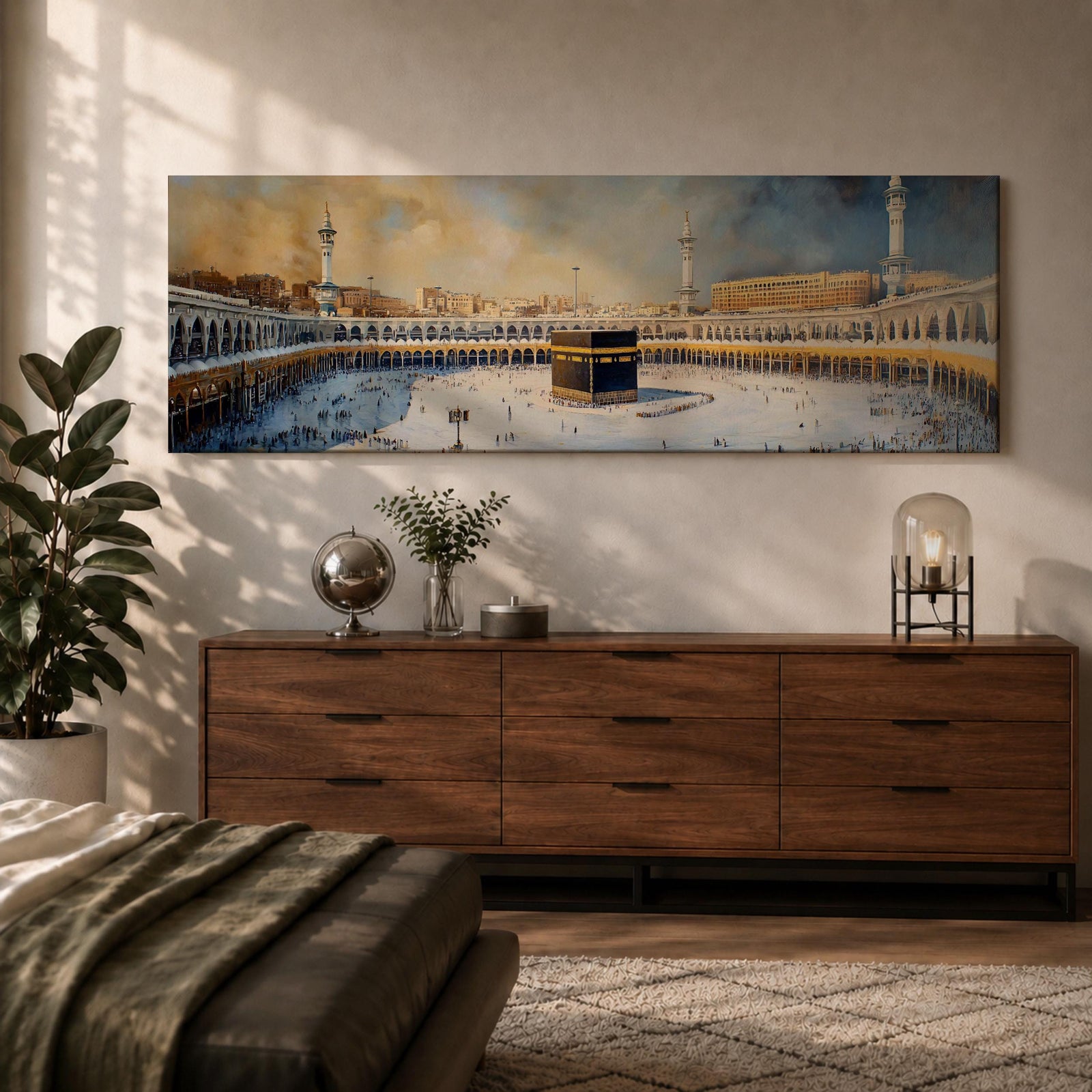 Panoramic Islamic wall art showing the Kaaba at Masjid Al Haram in Mecca surrounded by mosque arches, minarets, and pilgrims in a wide sacred courtyard scene.
