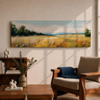 Panoramic countryside landscape painting showing a wide golden field filled with tall grasses and scattered wildflowers. A tree line borders the meadow while distant hills stretch across the horizon beneath a soft blue sky with light clouds across the expansive rural scene.