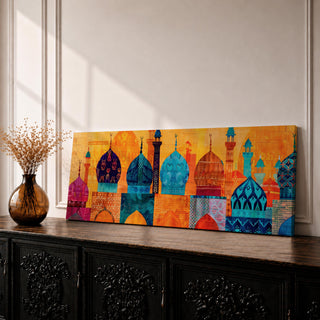 Panoramic illustration of colorful mosque domes and minarets arranged in a horizontal skyline. The composition features Moroccan inspired architectural forms with geometric patterns, tile motifs, and layered dome shapes in vibrant shades of turquoise, blue, orange, red, and gold across a stylized Islamic architectural landscape.