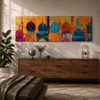 Panoramic illustration of colorful mosque domes and minarets arranged in a horizontal skyline. The composition features Moroccan inspired architectural forms with geometric patterns, tile motifs, and layered dome shapes in vibrant shades of turquoise, blue, orange, red, and gold across a stylized Islamic architectural landscape.