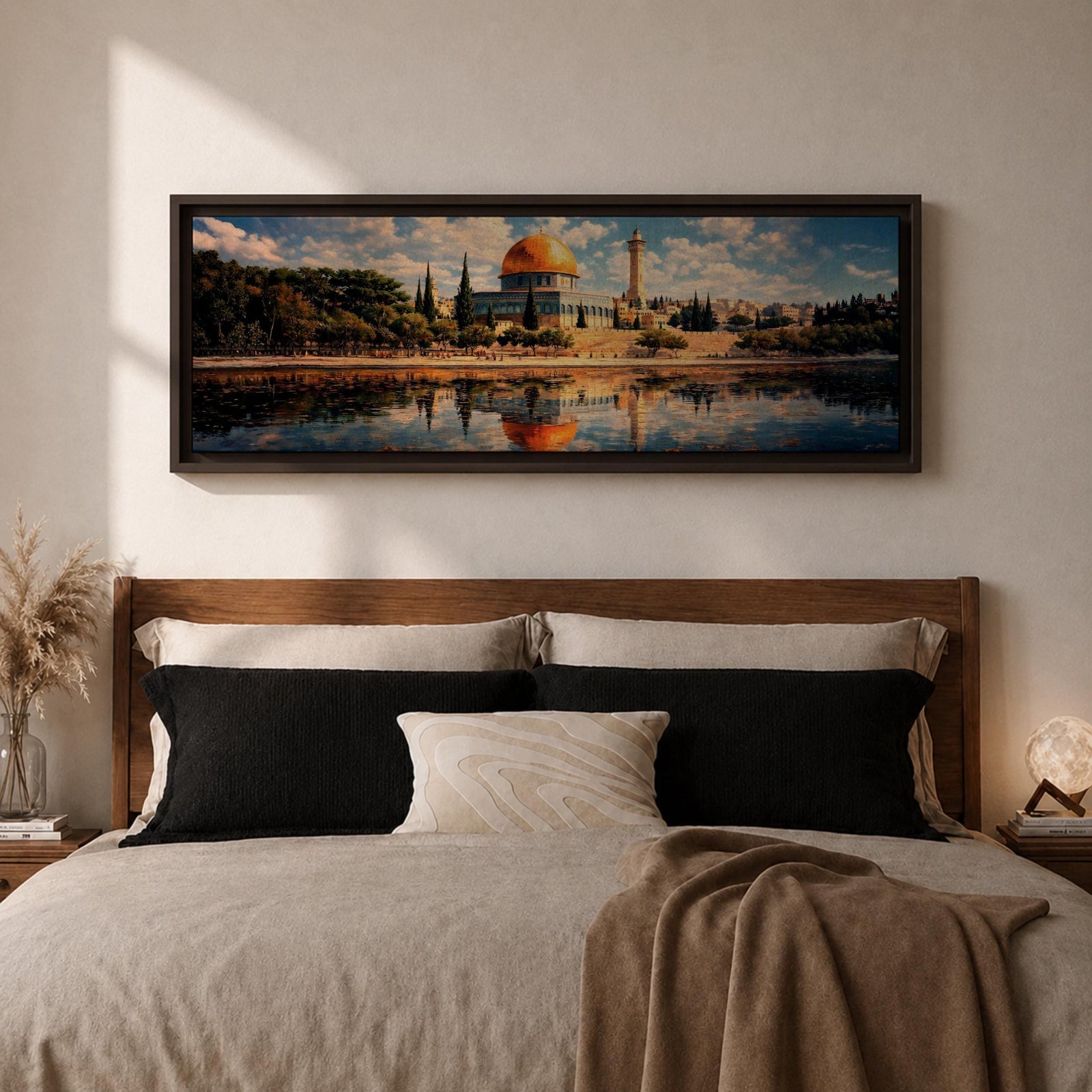 Panoramic canvas artwork depicting the Dome of the Rock in Jerusalem with its iconic golden dome and blue tiled octagonal structure rising above surrounding trees and historic buildings, reflected in calm water in the foreground beneath a bright sky filled with scattered clouds, rendered in a detailed landscape style emphasizing the architecture and skyline of the sacred site.