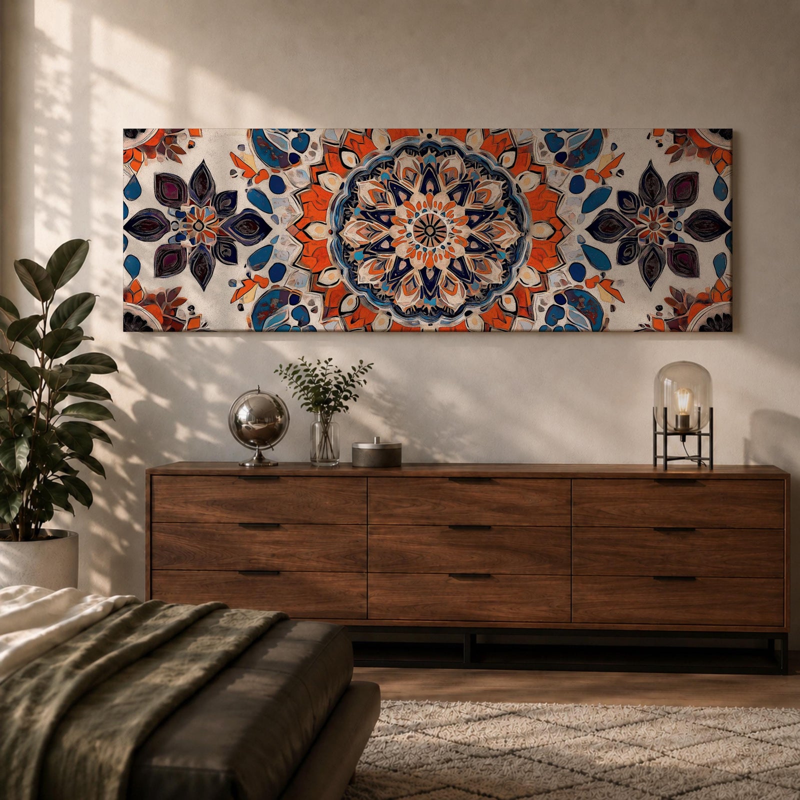 Panoramic artwork displaying an intricate Islamic mandala composed of symmetrical Moorish geometric and floral motifs radiating from a central rosette, featuring layered arabesque shapes and zellige inspired tile patterns in orange, blue, cream, and dark accents arranged in a balanced ornamental composition.