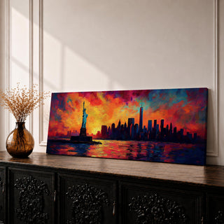 Panoramic cityscape painting showing the Statue of Liberty standing in the harbor with the New York City skyline stretching across the horizon, including tall skyscrapers and One World Trade Center, illuminated by a dramatic sunset sky filled with vibrant red, orange, and blue clouds reflected in the water.
