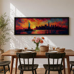 Panoramic cityscape painting showing the Statue of Liberty standing in the harbor with the New York City skyline stretching across the horizon, including tall skyscrapers and One World Trade Center, illuminated by a dramatic sunset sky filled with vibrant red, orange, and blue clouds reflected in the water.