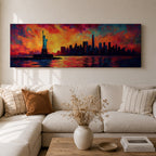 Panoramic cityscape painting showing the Statue of Liberty standing in the harbor with the New York City skyline stretching across the horizon, including tall skyscrapers and One World Trade Center, illuminated by a dramatic sunset sky filled with vibrant red, orange, and blue clouds reflected in the water.