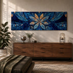 Panoramic floral mandala artwork featuring a symmetrical lotus flower design with layered petals spreading outward in deep blue and gold tones, accented with delicate botanical shapes and watercolor textures that create an intricate ornamental pattern across a wide horizontal composition.