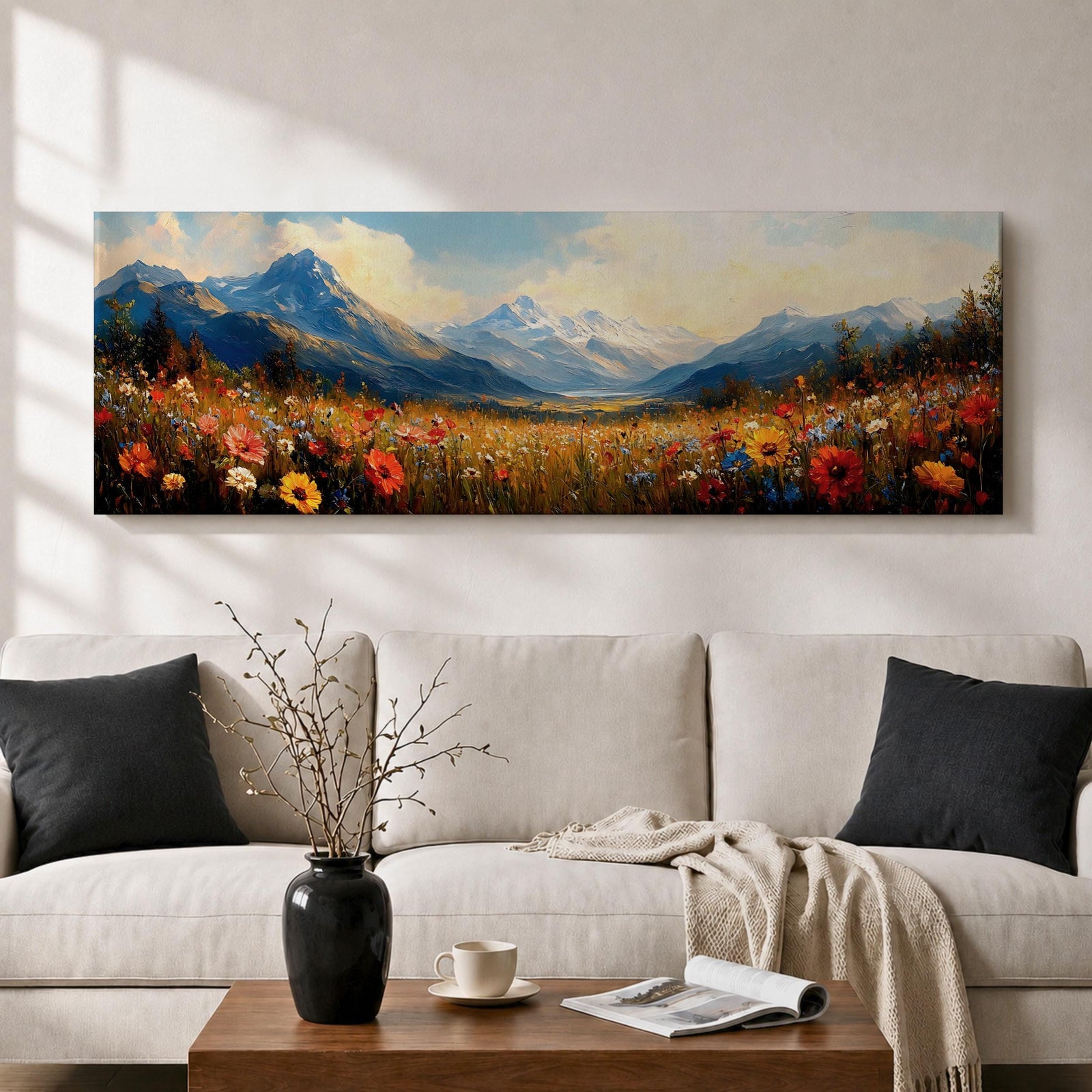Panoramic landscape painting depicting a wide alpine meadow filled with colorful wildflowers in the foreground leading toward distant snow capped mountains, with rolling hills and soft clouds above, rendered in warm natural tones and expressive brushstrokes forming a sweeping scenic mountain vista.