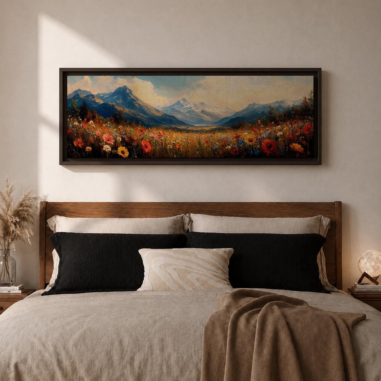 Panoramic landscape painting depicting a wide alpine meadow filled with colorful wildflowers in the foreground leading toward distant snow capped mountains, with rolling hills and soft clouds above, rendered in warm natural tones and expressive brushstrokes forming a sweeping scenic mountain vista.