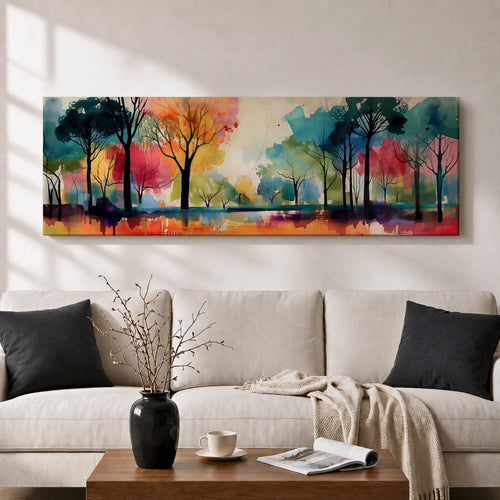 Panoramic abstract watercolor painting of a forest landscape with tall slender tree silhouettes reflected in still water, surrounded by vibrant washes of teal, orange, red, yellow, and green forming a colorful woodland scene with expressive brushwork and soft atmospheric blending.
