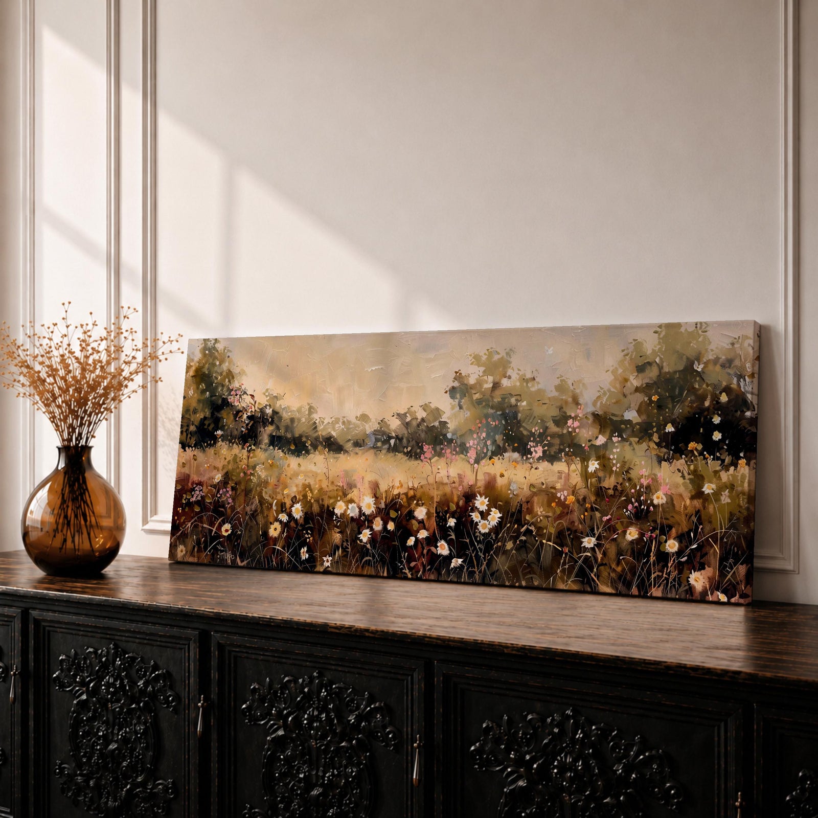 Panoramic landscape painting of a wildflower meadow filled with blooming daisies and delicate field flowers scattered across tall grasses, with soft trees along the horizon and warm sunlight illuminating the countryside scene rendered in earthy tones and loose expressive brushstrokes.