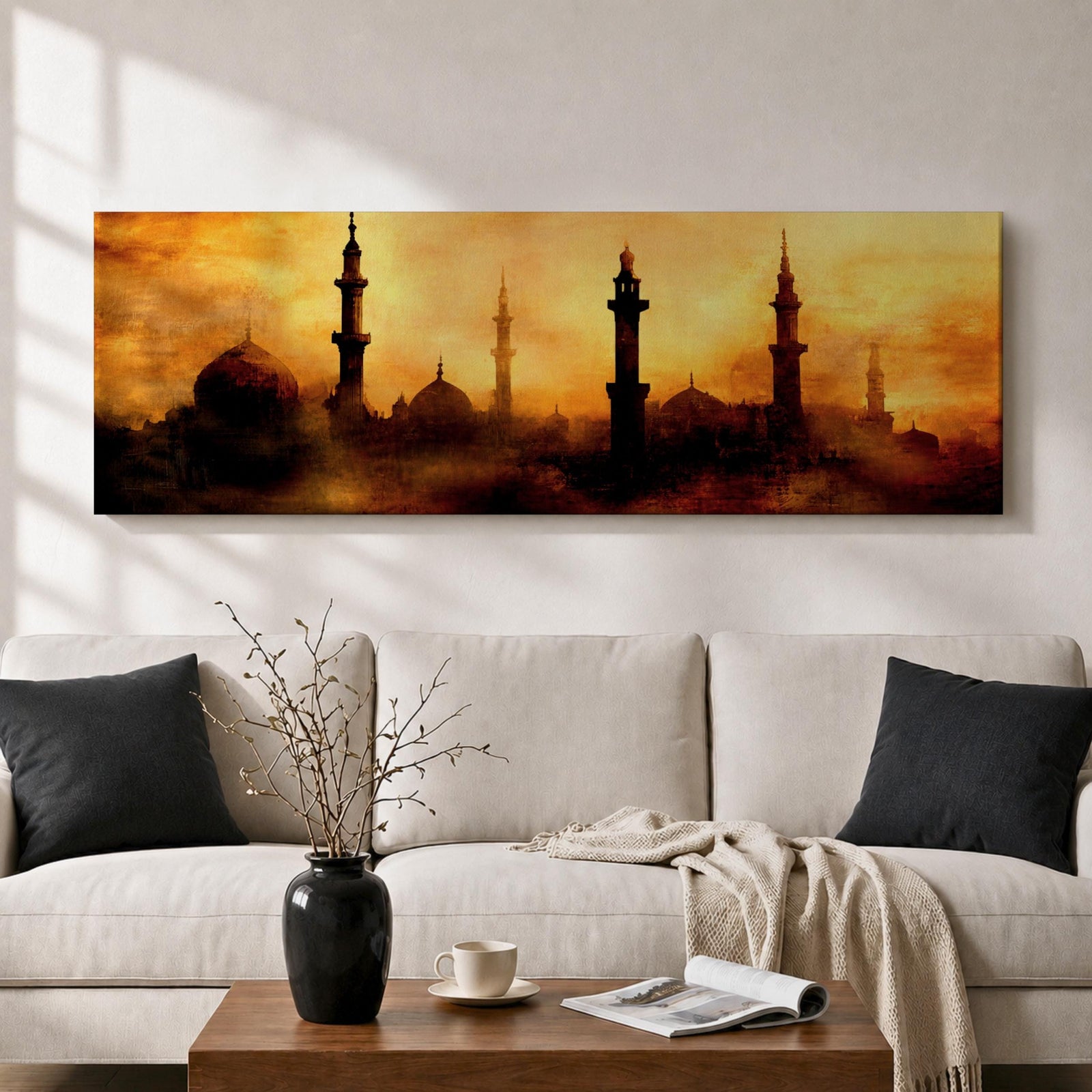 Panoramic artwork depicting a dramatic skyline of mosque domes and tall minarets silhouetted against a glowing golden sunset sky, with warm amber and orange tones diffused through atmospheric haze creating a striking Islamic architectural horizon.