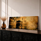 Panoramic artwork depicting the Kaaba in Mecca surrounded by the Masjid al-Haram courtyard with tall minarets rising through golden atmospheric light and dramatic clouds, creating a sacred Islamic architectural scene.