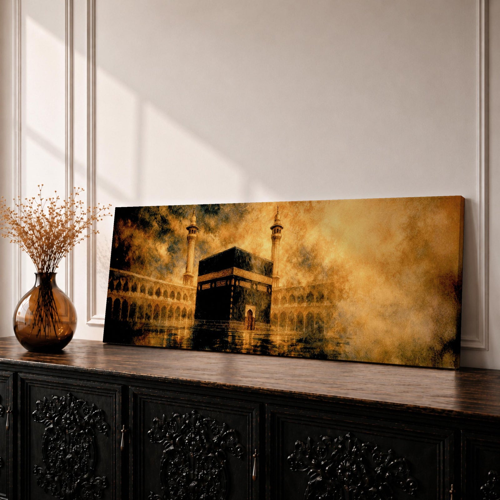 Panoramic artwork depicting the Kaaba in Mecca surrounded by the Masjid al-Haram courtyard with tall minarets rising through golden atmospheric light and dramatic clouds, creating a sacred Islamic architectural scene.