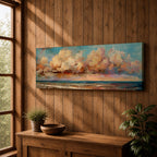 Panoramic coastal painting featuring dramatic sunset clouds above the ocean horizon with waves along a sandy beach, rendered in warm pastel sky tones and textured brushstrokes creating a peaceful seaside landscape.
