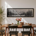 Panoramic monochrome landscape artwork depicting snow covered mountains and a dense pine forest with a winter valley scene rendered in black and white tones.
