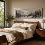 Panoramic monochrome landscape artwork depicting snow covered mountains and a dense pine forest with a winter valley scene rendered in black and white tones.