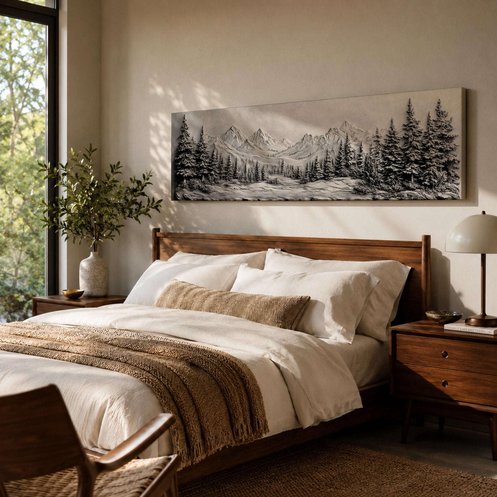 Panoramic monochrome landscape artwork depicting snow covered mountains and a dense pine forest with a winter valley scene rendered in black and white tones.