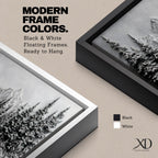 Panoramic monochrome landscape artwork depicting snow covered mountains and a dense pine forest with a winter valley scene rendered in black and white tones.