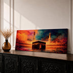 Panoramic artwork depicting the Kaaba in Mecca inside Masjid al-Haram surrounded by mosque arches and minarets with dramatic abstract sunset colors and glowing atmospheric light.