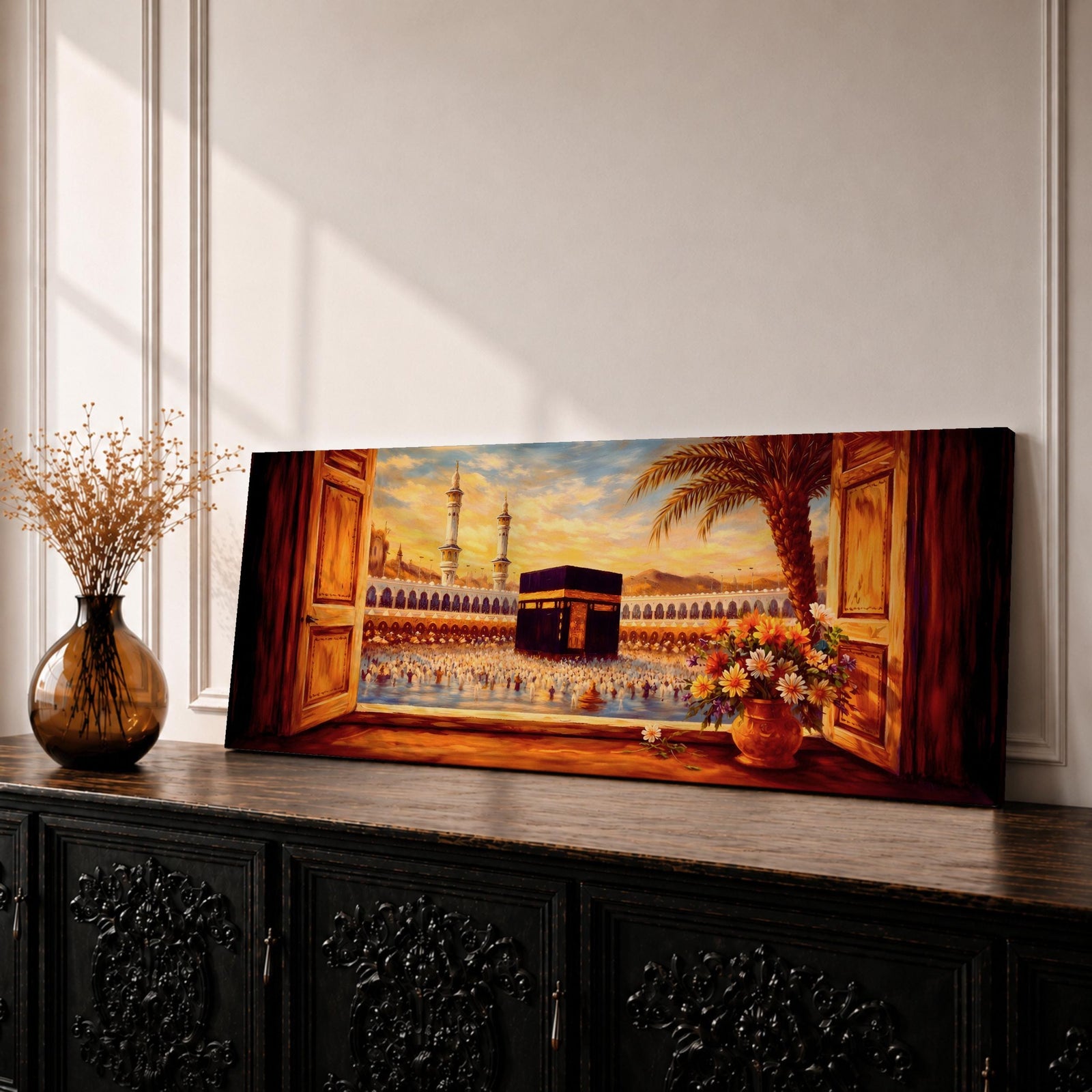A panoramic painting of the Kaaba at the center of Masjid al Haram in Mecca viewed through open wooden window shutters, with a palm tree and flowers in the foreground while thousands of worshippers gather around the sacred structure, illuminated by warm sunlight beneath a softly glowing sky.