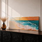 A panoramic textured painting of turquoise ocean waves rolling onto a sandy beach beneath a glowing sunset sky, with thick palette knife brushstrokes creating foamy white surf and layered teal water while warm orange light reflects across the horizon in a wide coastal seascape composition.