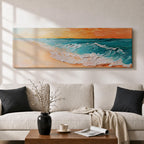 A panoramic textured painting of turquoise ocean waves rolling onto a sandy beach beneath a glowing sunset sky, with thick palette knife brushstrokes creating foamy white surf and layered teal water while warm orange light reflects across the horizon in a wide coastal seascape composition.